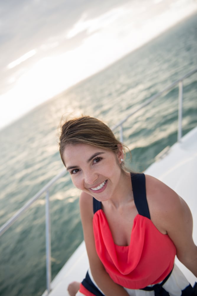 Beautiful woman sailing in a Lagoo yacht enjoying her vacations