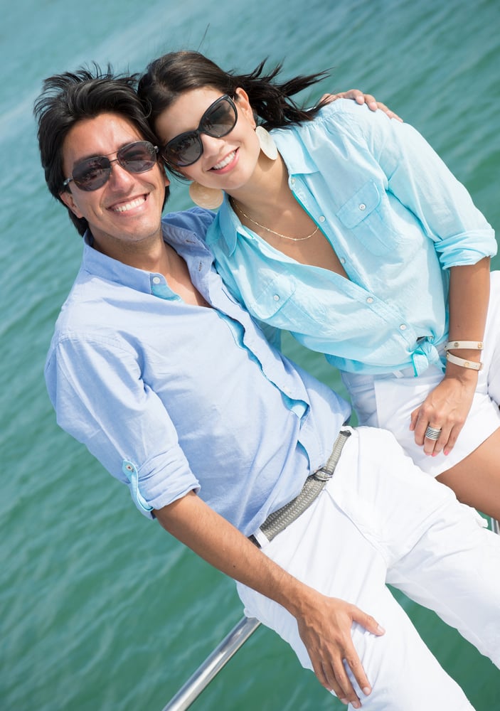 Couple enjoying the summer in a Lagoo boat looking very happy